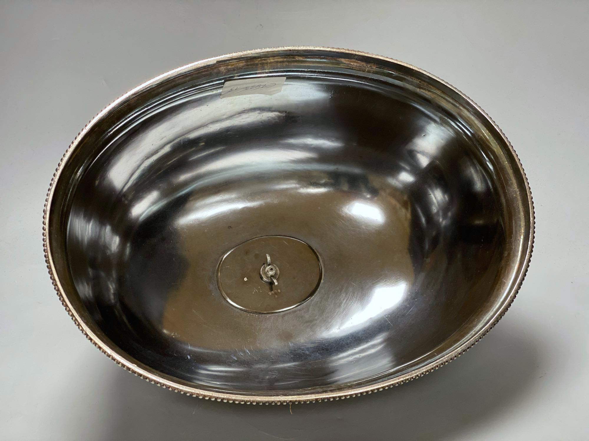 A silver plated engraved meat dome, width 33cm